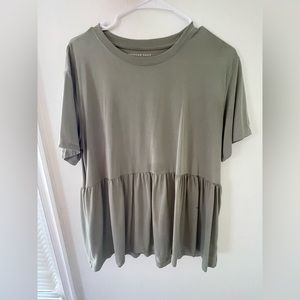 A comfy olive green top, has small stains- not sure what they are